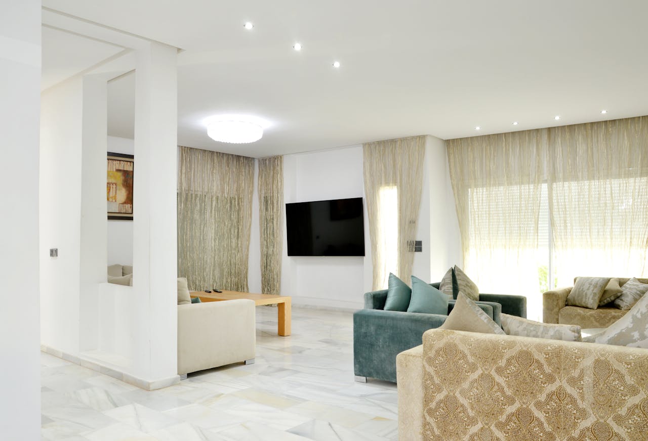 gallery-2 Spacious modern living room with elegant sofas and stylish decor.